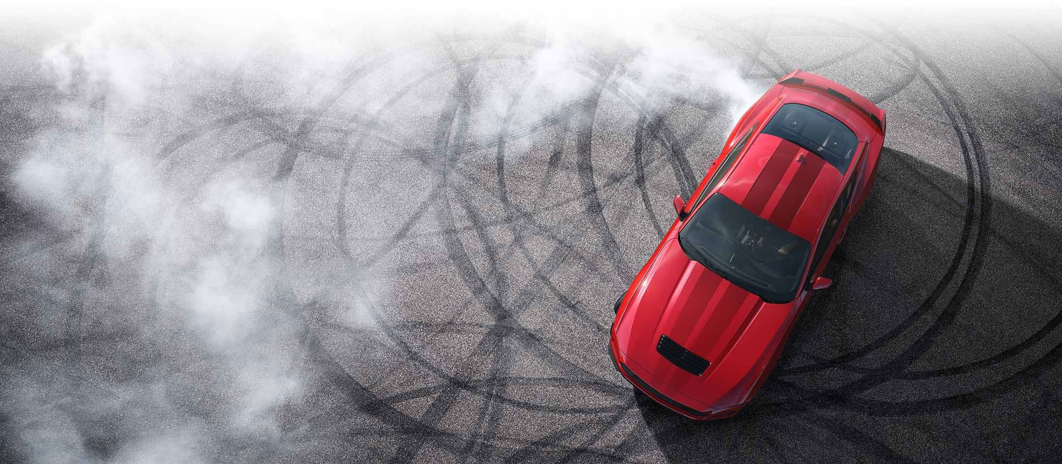 Overhead view of a 2024 Ford Mustang® model with tire tracks on pavement | Plantation Ford in Plantation FL