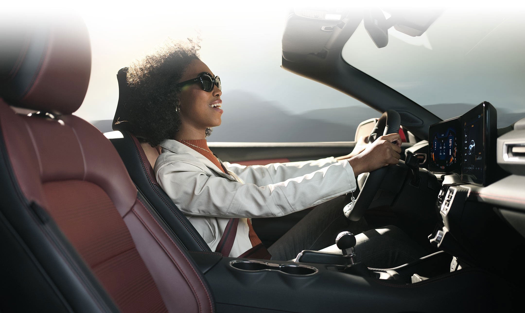 Person sitting in the driver’s seat of a 2024 Ford Mustang® convertible | Plantation Ford in Plantation FL