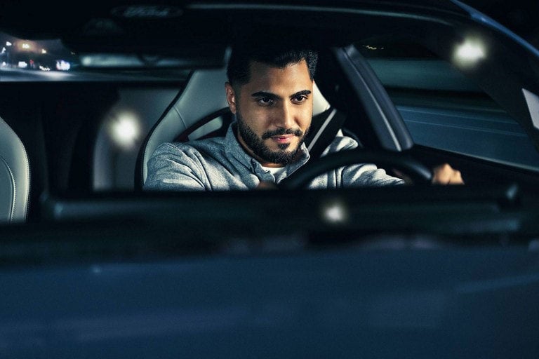 Person sitting in the driver’s seat of a parked 2024 Ford Mustang® coupe | Plantation Ford in Plantation FL