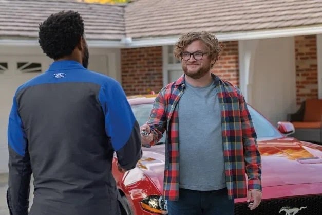 Customer in Driveway with FORD Technician